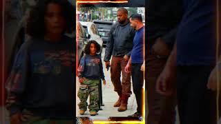 Kanye west was seen in Burbank visiting Sports Cards and TCG with his son Psalm West