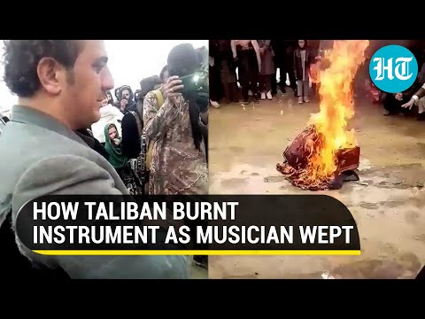 Watch: Taliban men laugh, burn instrument as Afghan musician weeps; cite Sharia law