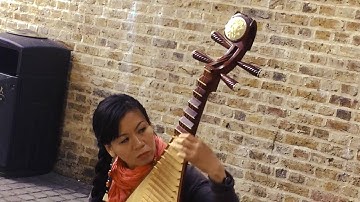 Chinese Musical Instruments - The Pipa or Lute played by street performer