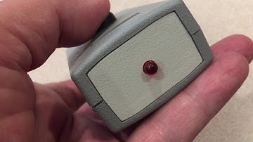 Darkroom metronome timer in an enclosure.