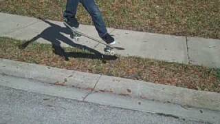 small skate video frontside 180 over a grass gap