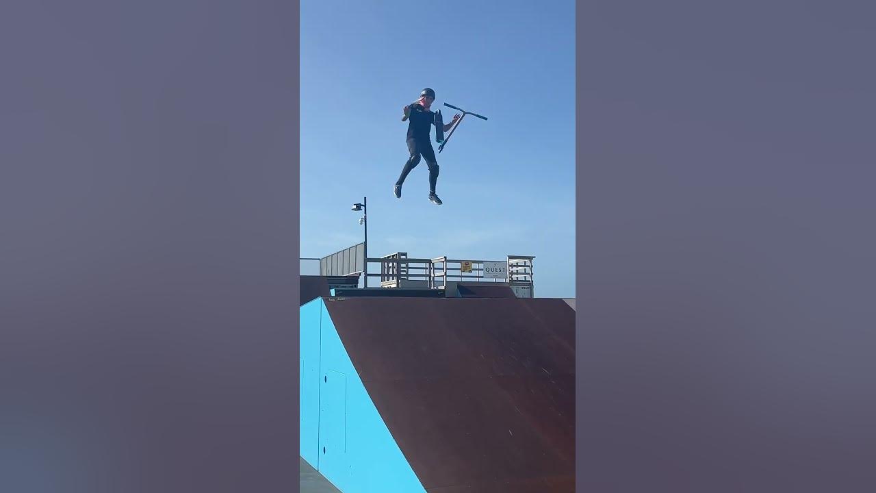 Girl Rider Nothing front scooter flip to whip at the skate park