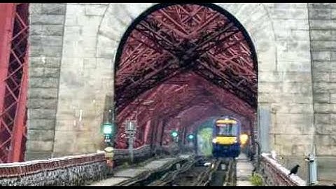 Diesel Passenger Train Crossing Iconic Forth Railway Bridge Firth Of Forth Scotland