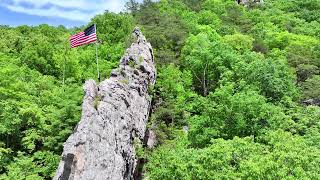 American flag footage someone put an American flag on a rock face. May 18th 2024