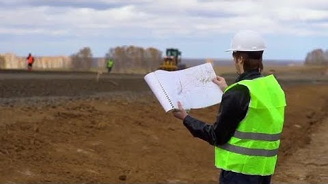 Engineer Looking At The Blueprint Stock Video