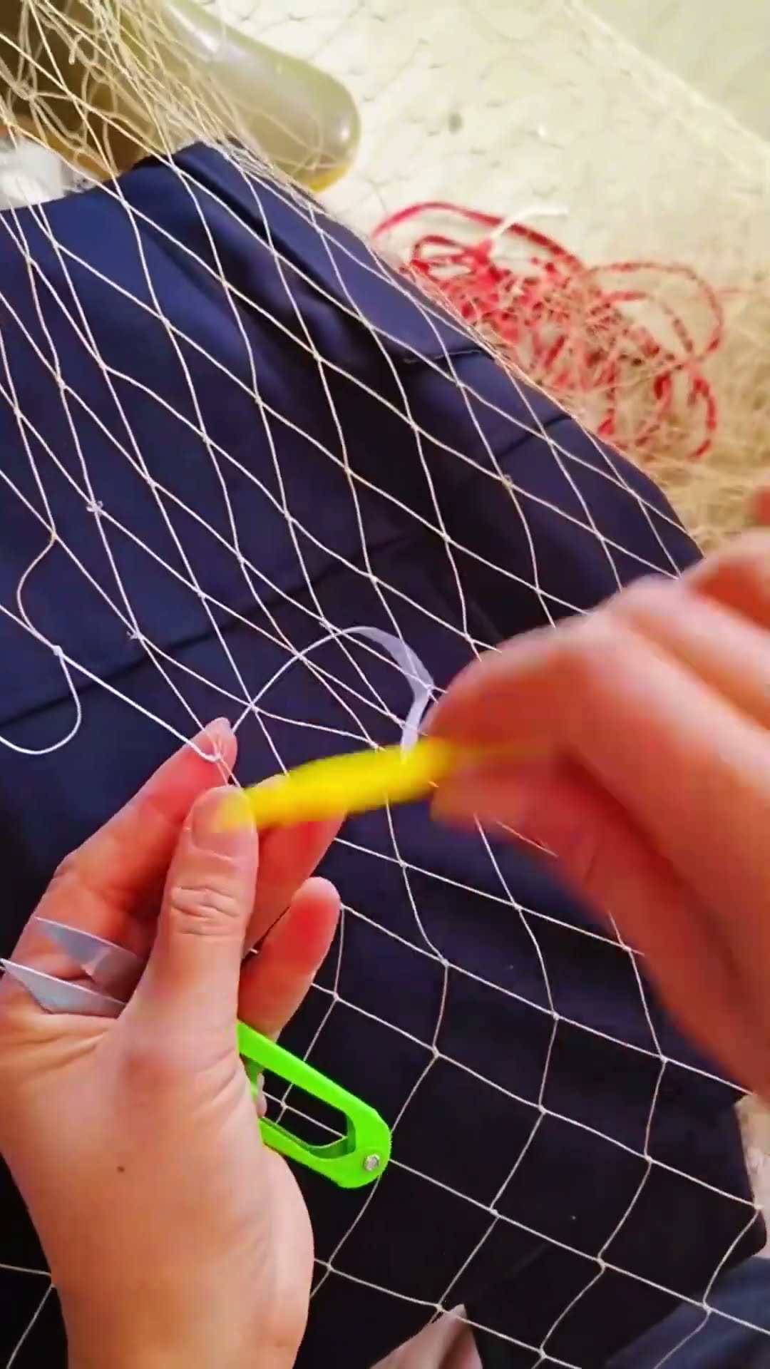 The process of repairing broken fishing nets- Good tools and machinery make work easy