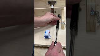 Installing a Gas Strut in a Concealment Shelf