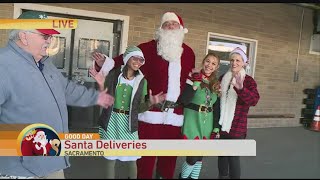 Postal Trucks Deliver Gifts