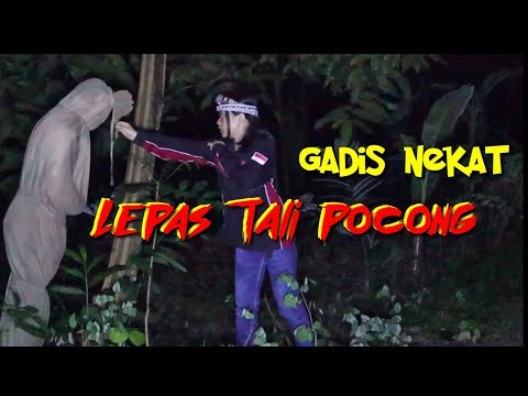 A BEAUTIFUL GIRL DESPERATELY REMOVES THE ROPE OF THE SHROUD