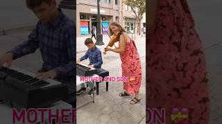 Martin & mom with baby Emma still in the belly street perform #despacito #luisfonsi #motherandson