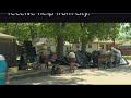 Dallas neighborhood wants city to help the homeless who have set up a camp on an empty lot.