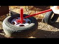 Changing a tire with Harbor Freight manual tire changer