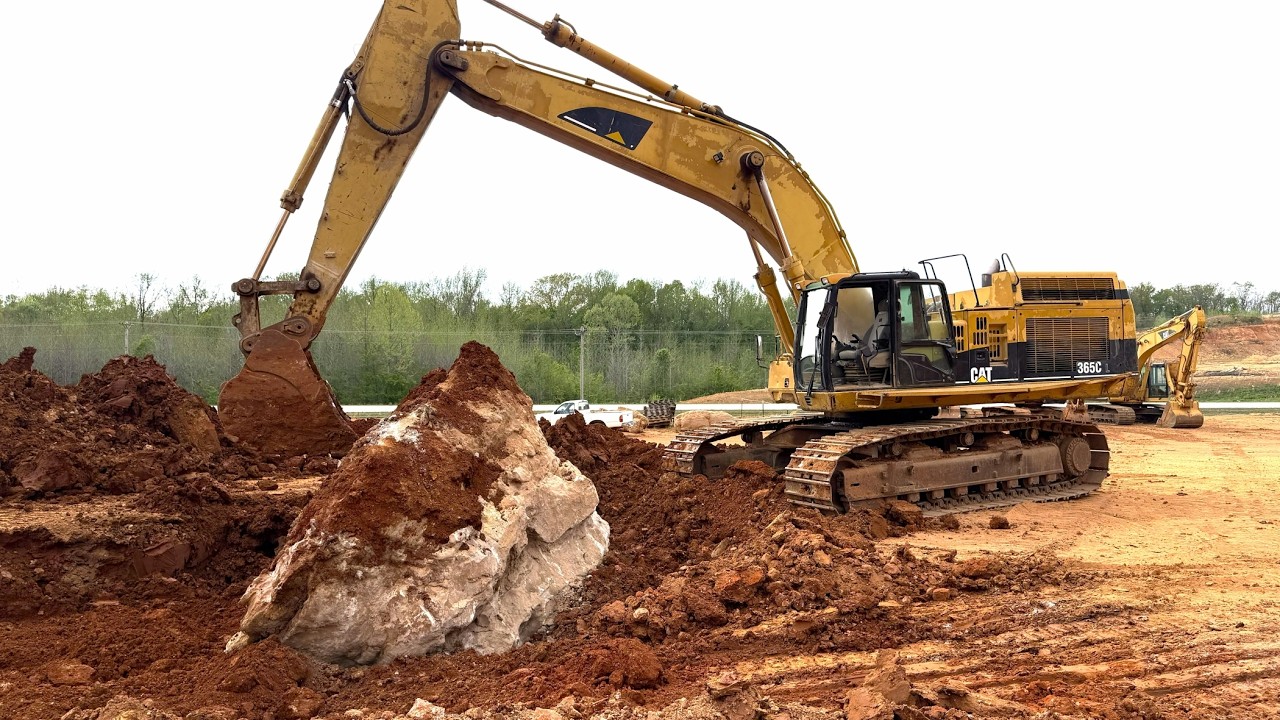 Caterpillar 365C Excavator vs. 80,000+ Pound Boulder