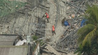 Building under construction in Philippines collapses, leaving 1 dead and 21 trapped