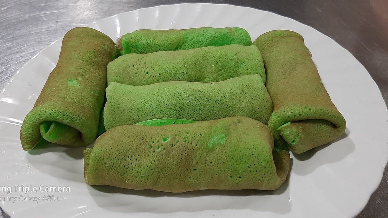 Pancake roll with sweet grated coconut filling 