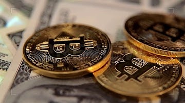 Bitcoins And Dollars Stock Video