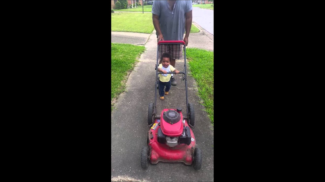 My son baby beast pushing a lawn mower at 11months