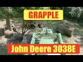 John Deere tractor 3038e   grapple   to big to lift &amp; move   so we will push it