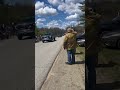 Morrill volunteer firefighter David White salutes as the procession passes