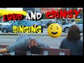 Loud  cringy singing in public