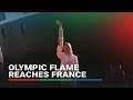 Olympic cauldron lit on French soil for Games
