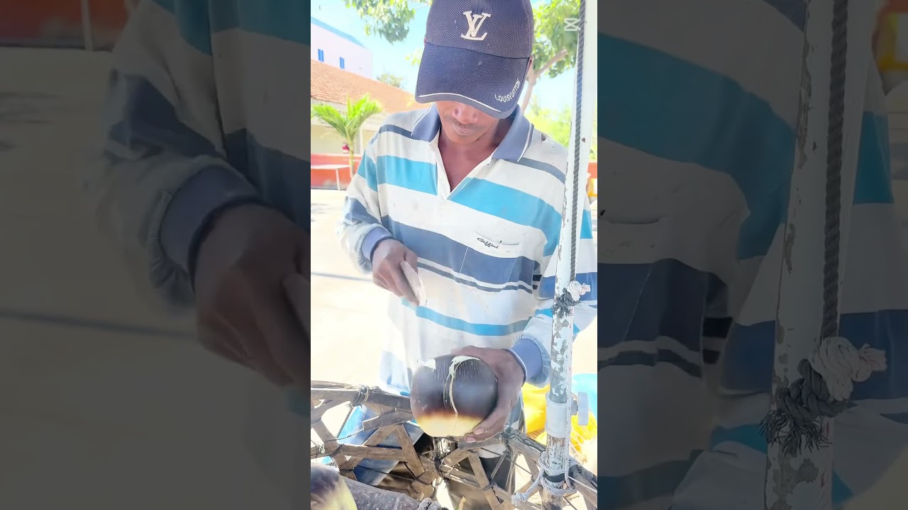 Amazing palm fruits cutting skills by man. Street food Cambodian 