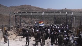 Hundreds of Druze community members gather at Golan Heights border amid clashes in Syria