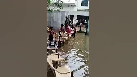 Viral Video Shows Teacher Entering Flooded School, Students Hold Chairs - DayDayNews