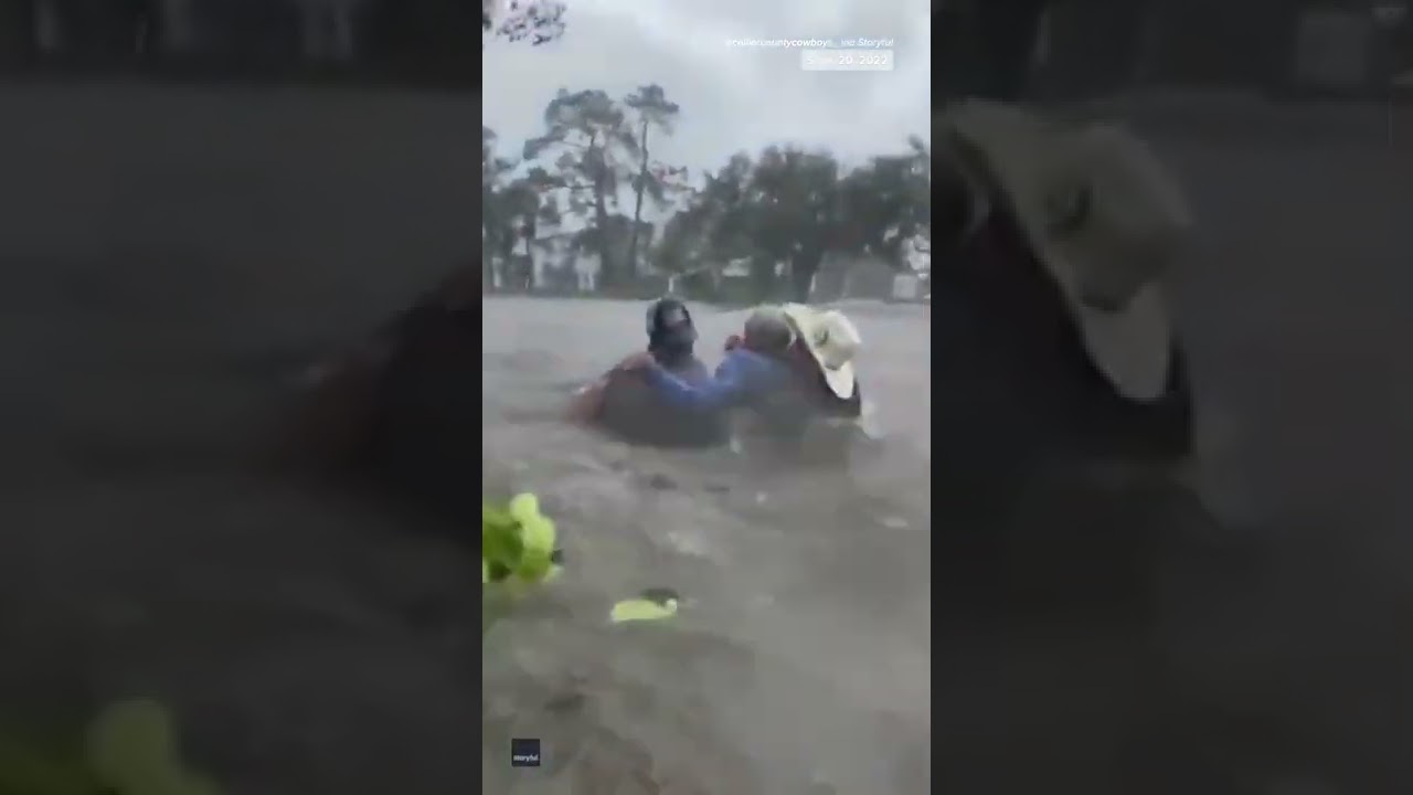 Dramatic Rescue Of Elderly Man Stranded In Car During Hurricane Ian