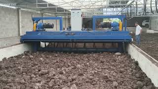 Trough-type compost turning machine, composting machine, compost turner working site.
