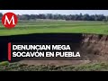 Reportan socavón de alrededor de 100 metros en campos de cultivo de Puebla
