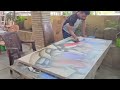 Artist jagannath paul blending charcoal in his studio
