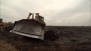 D8R, 621F, D6T, and 623F attacking black dirt