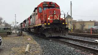 CN L568 departs Kitchener with a friendly engineer