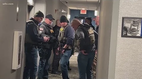 Person of interest detained in Brown University shooting probe