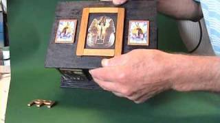 An Egyptian style puzzle box, with fifteen outer sliding panels, and two seperate keys. Very hard to open...