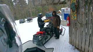 Snowmobiling in Maine...Arriving at libbys camp to stuff the tank