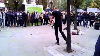 Man and woman join busker Manchester