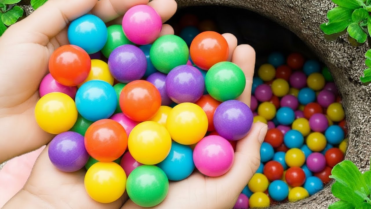Catch beautiful glass marbles in small rooftop garden, crystal balls, rainbow marbles