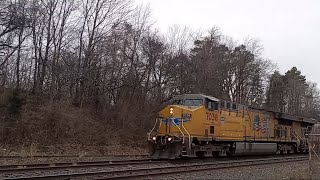 CSX I132 EB with the UP7038 leading, clears through the Sidney Big Four train station.