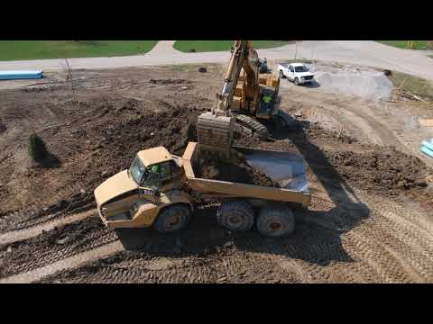 DRONE VIEW of Excavator Loading Dump Truck //Cat 740 Off Road Dump Round Trip-Residential Excavating