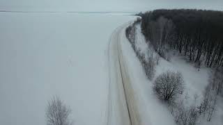 Winter wood and road in Russia