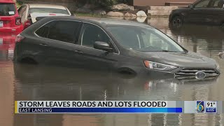 20 cars caught in flood outside East Lansing apartments