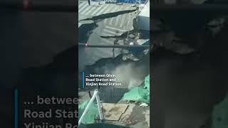 Watch as road is swallowed up into sinkhole at subway construction site in China