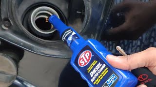 STP Diesel Injector Cleaner Concentrated additive being poured in my Toyota Fortuner's fuel tank