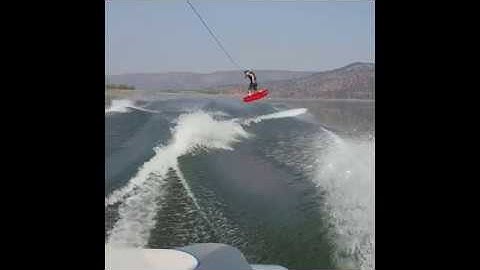 Wakeboarding tail grab backside 180