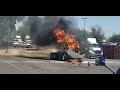 Truck on fire    employee fights the fire to try to put it out