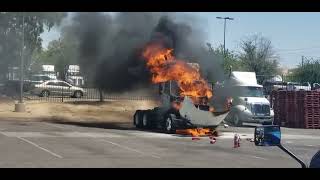 Truck on fire  employee fights the fire to try to put it out