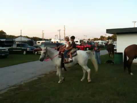 Samuel riding a horse with Ashley