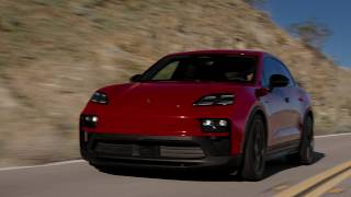 2026 Porsche Macan GTS Electric in Carmine Red on the road